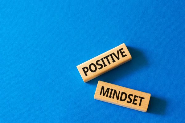 blue background and two rectangular blocks with Positive and Mindset