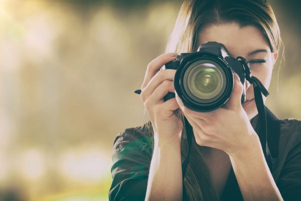 photographer taking a photo with a professional camera