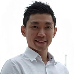 Davis Lin headshot photo, smiling man with dark hair wearing a white collared shirt