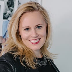 Laura Gmeinder PCC headshot photo, smiling woman with blond hair wearing dark top