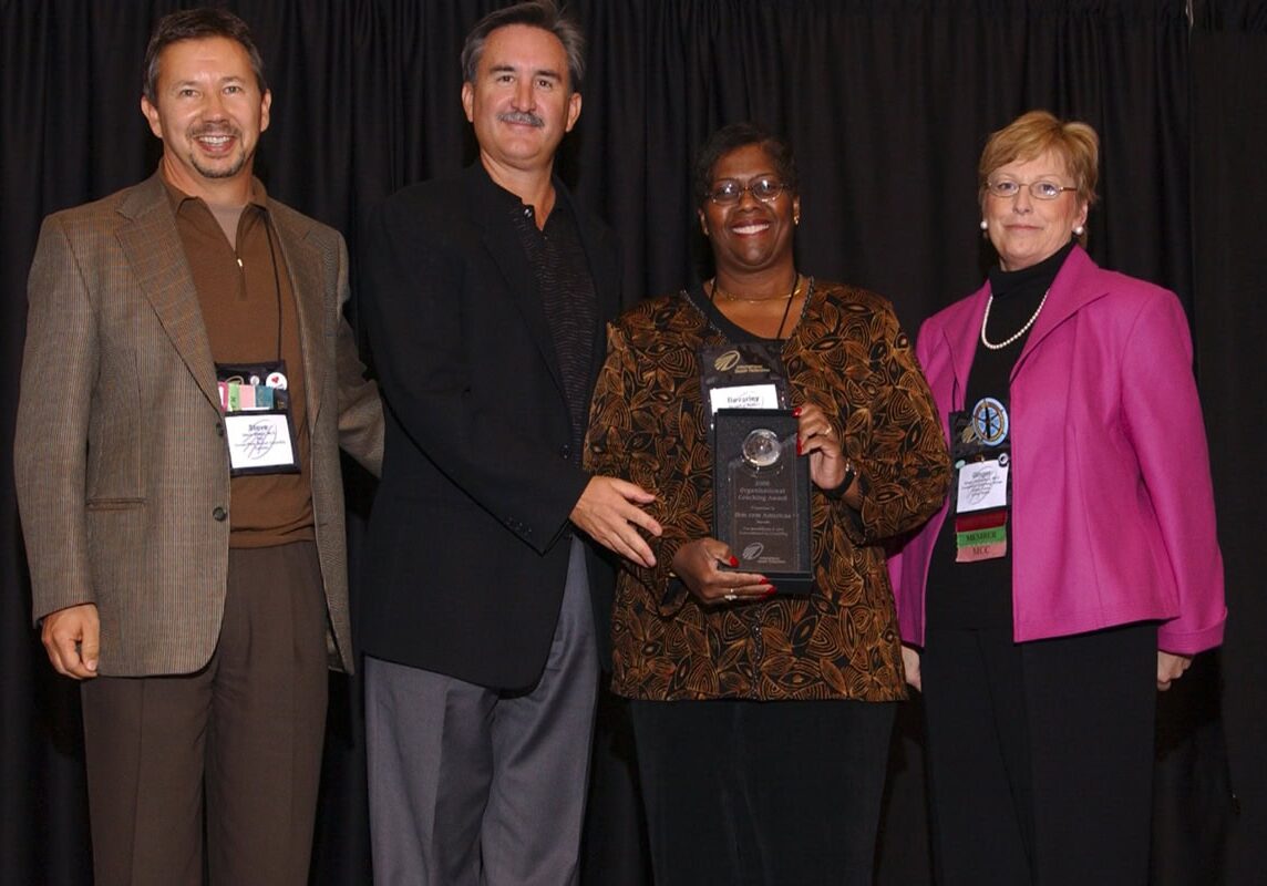 Group photo of the 2005 ICF Prism Award winners, celebrating the inaugural year of the award for organizations with strong coaching cultures.