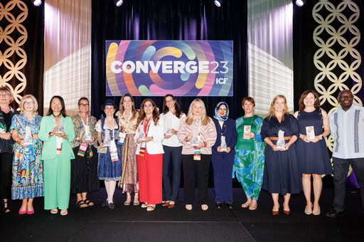 A group photo of the 2023 ICF Coaching Impact Award winners at ICF Converge 2023, proudly holding their awards in recognition of their contributions to the coaching profession.