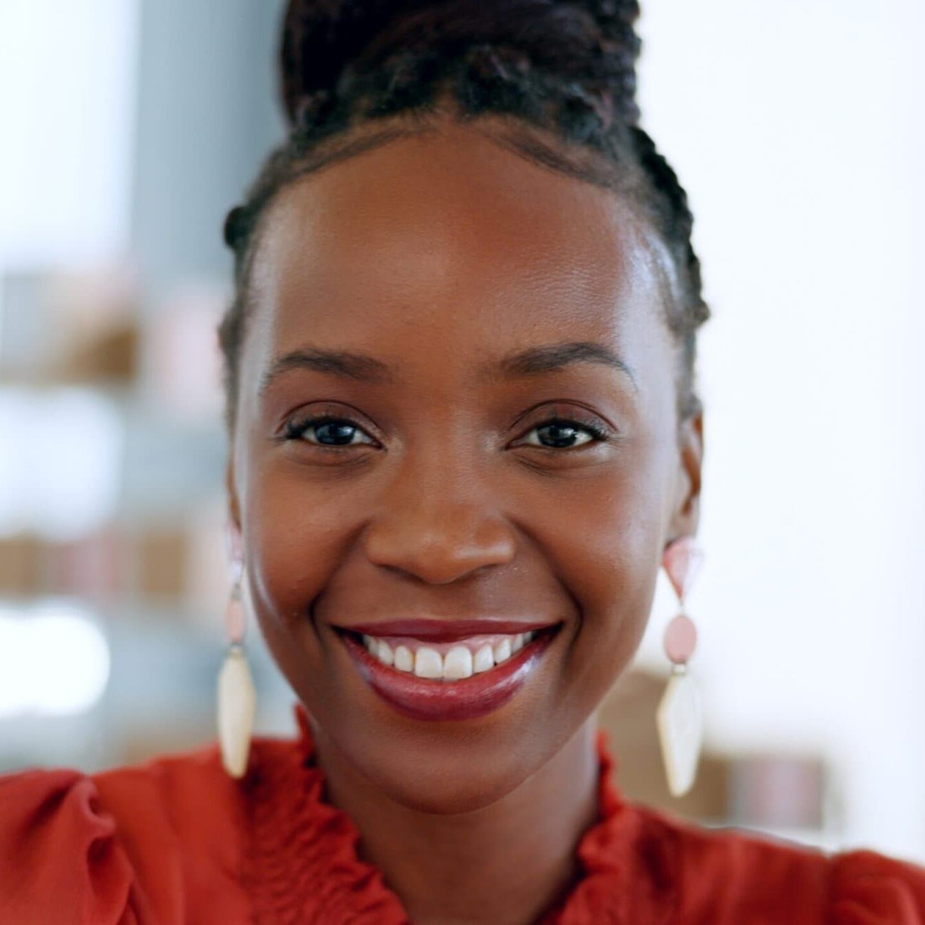 Professional woman smiling in a modern office setting