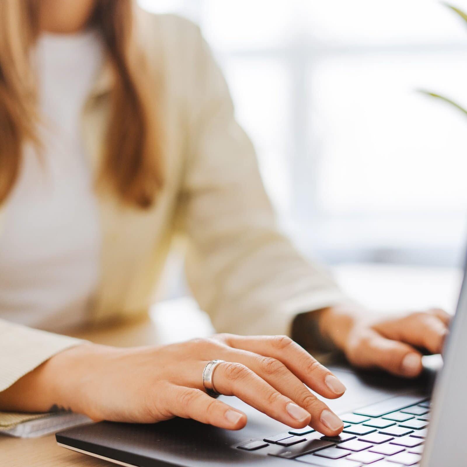 Young,Woman,Happily,Working,From,Home,On,Her,Laptop,,Copywriter