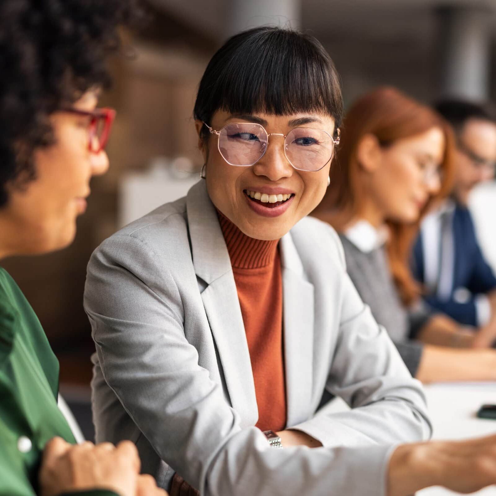 Professional,Coworkers,Are,Engaged,In,A,Collaborative,Discussion,In,A