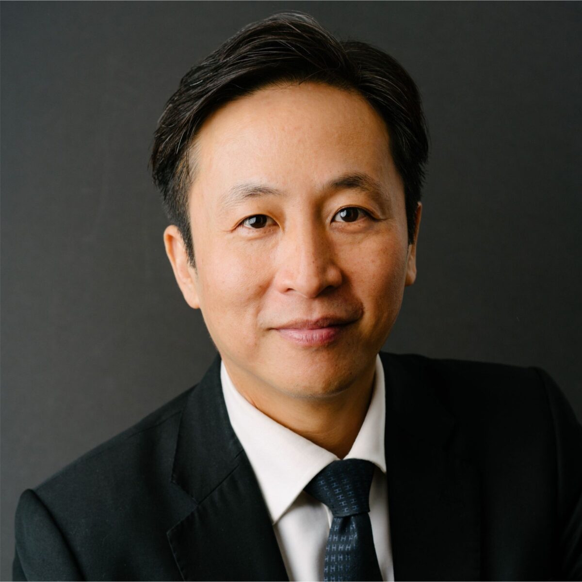 Headshot of Soon Loo, MCC with the International Coaching Federation. Known for his leadership across finance, technology, and education, and his research in coaching and AI.