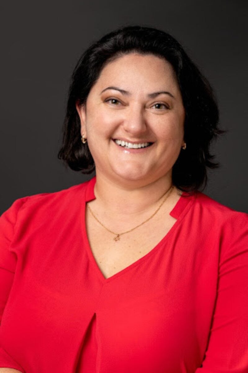 Jenny Barkan ACC headshot photo, smiling woman with dark hair