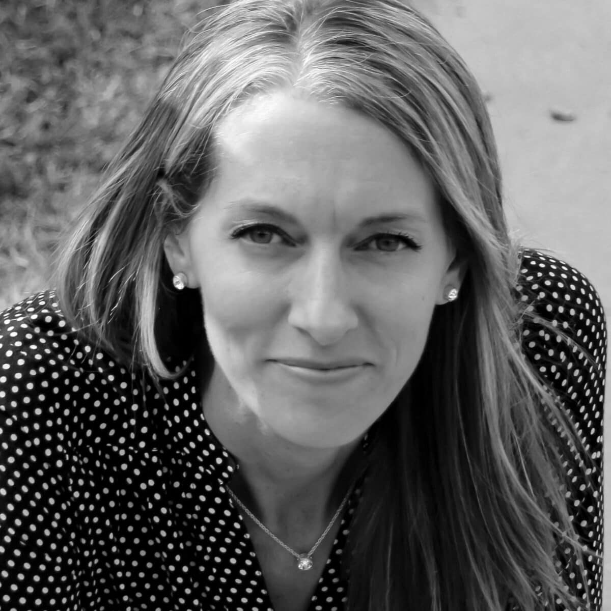 Rachel Thalmann PCC headshot photo, smiling woman with collared shirt in black and white
