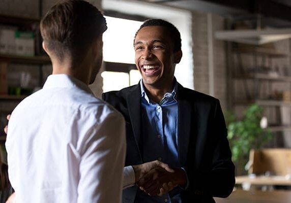 two men meeting and shaking hands