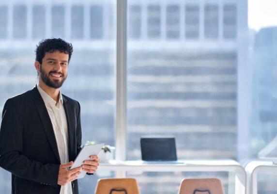 coach ready for clients holding a tablet